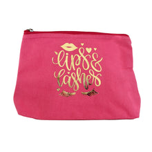Load image into Gallery viewer, It&#39;s all about the lips and lashes!  Made from 100% cotton canvas, these pretty fuschia pink toiletry / make up bags with zip closing have a waterproof lining and gold foil design.    Dimensions: 15 x 27 x 7 cm
